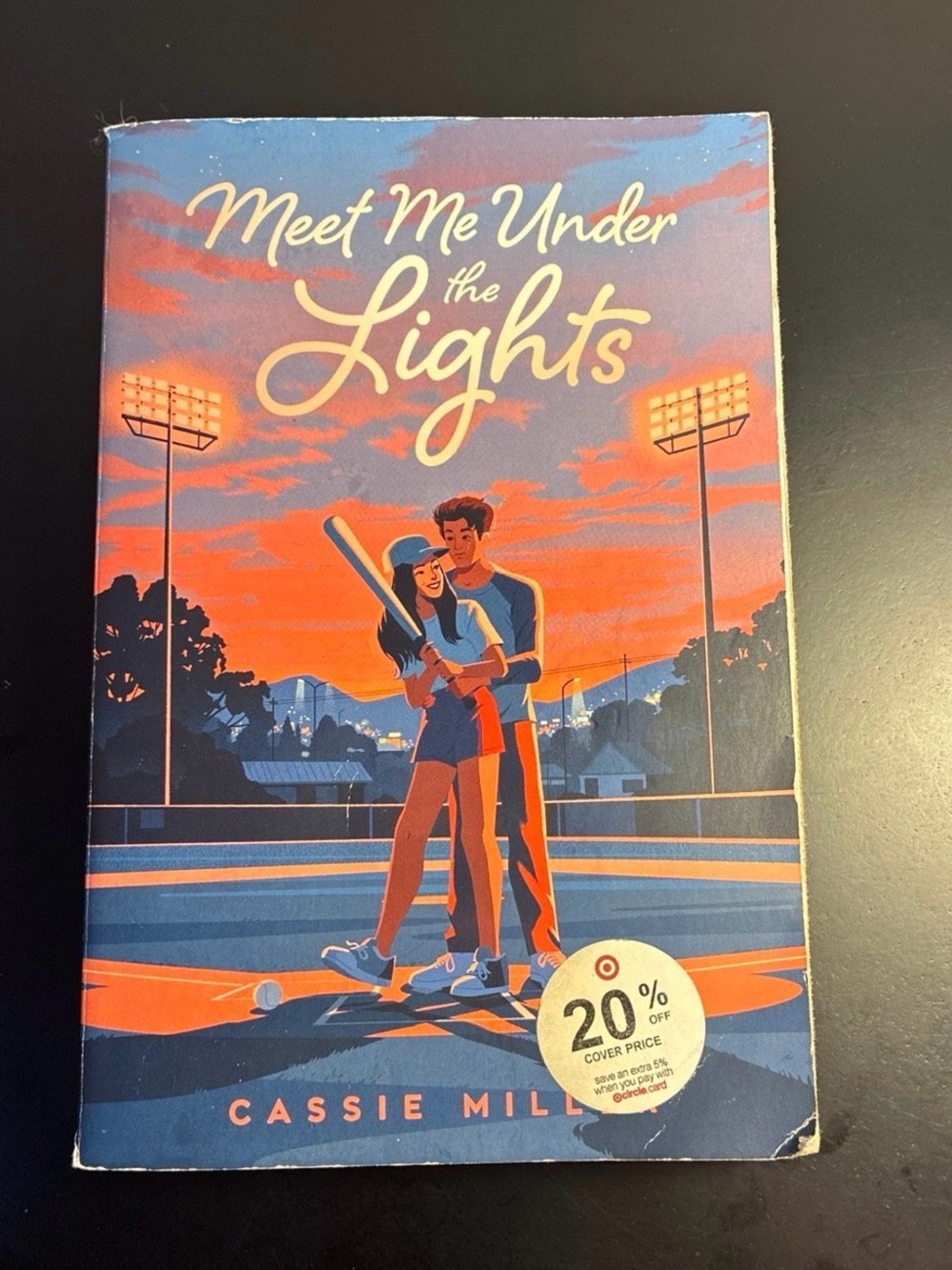 Meet Me Under the Lights Paperback by - Blue & Orange Cover
